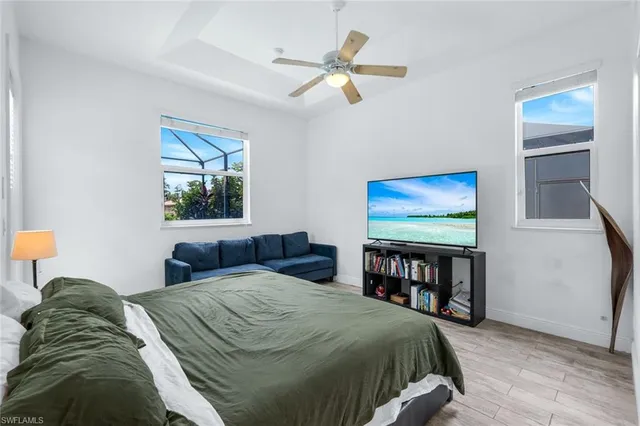 a bedroom with a bed and window