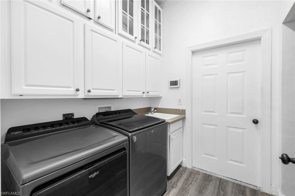 14846 Toscana Way Naples, FL 34120 - Photo 26 of 33 a view of a refrigerator and window