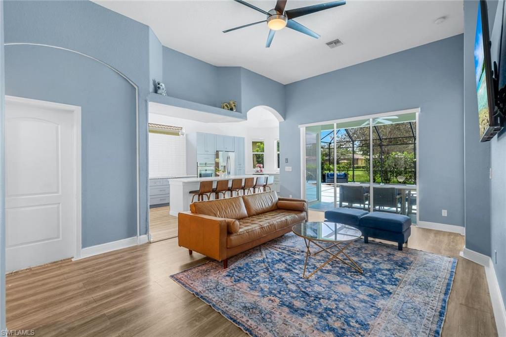 14846 Toscana Way Naples, FL 34120 - Photo 6 of 33 a living room with furniture and a large window