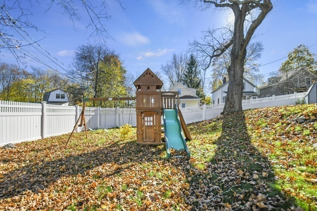 54 Thomas Street Dedham, MA 02026 - Photo 14 of 17 a view of a yard in front of the house