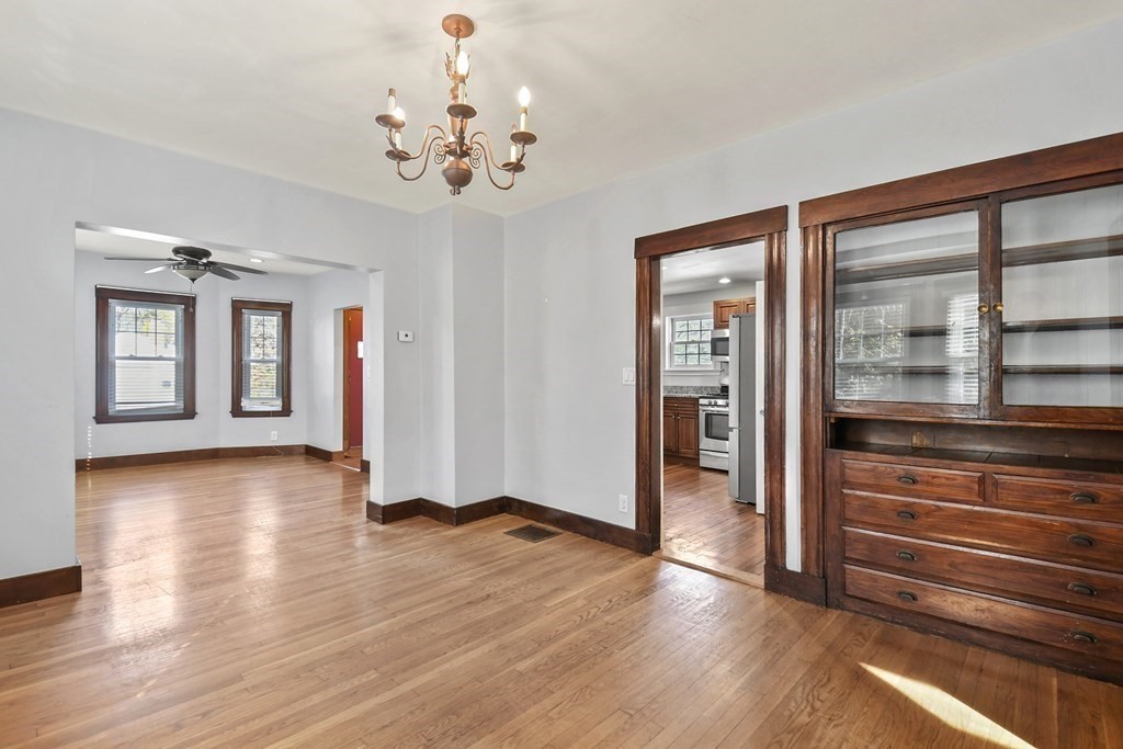 54 Thomas Street Dedham, MA 02026 - Photo 7 of 17 a view of a room with wooden floor and windows