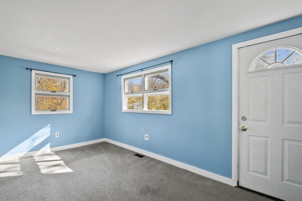 54 Thomas Street Dedham, MA 02026 - Photo 8 of 17 a view of an empty room with a window