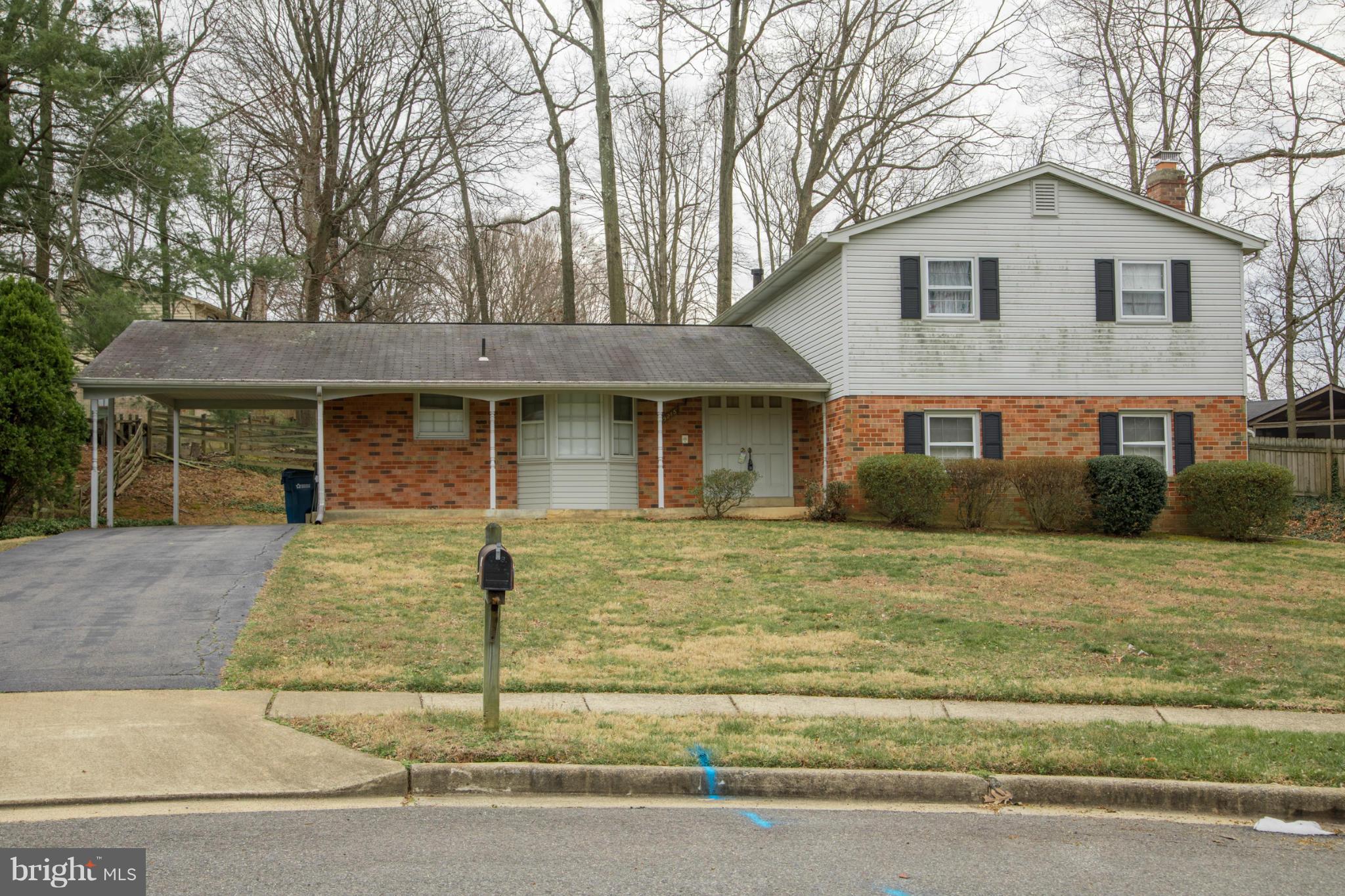 9215 Setter Place Springfield, VA 22153 - Photo 1 of 23 a front view of a house with garage