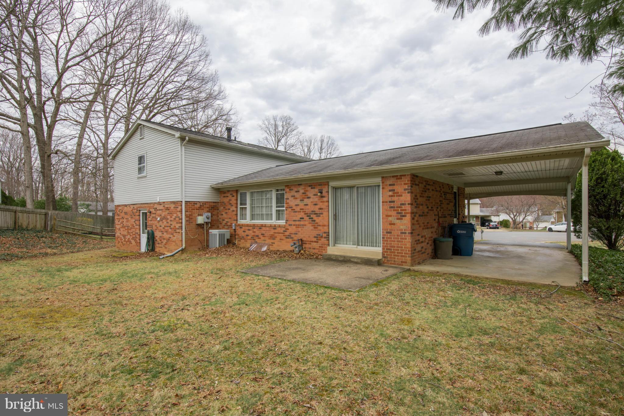 9215 Setter Place Springfield, VA 22153 - Photo 2 of 23 a view of a house with a patio and a yard