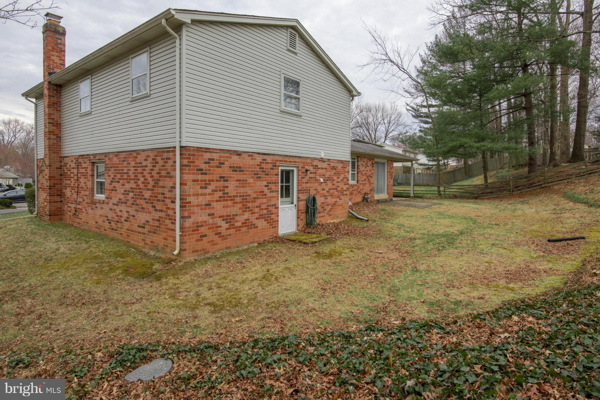 9215 Setter Place Springfield, VA 22153 - Photo 3 of 23 a view of a house with a yard