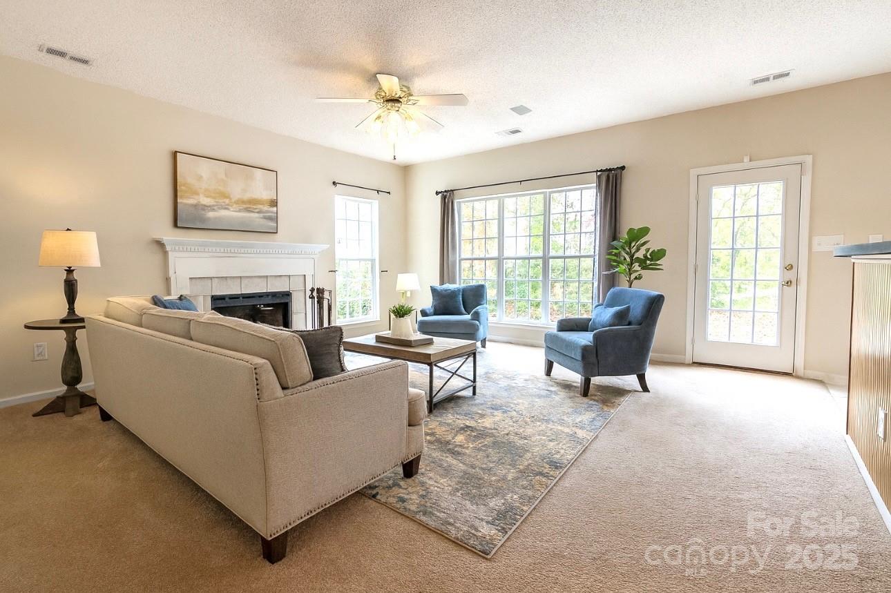 1600 Trotters Ridge Road Stanfield, NC 28163 - Photo 12 of 32 a living room with furniture and a fireplace