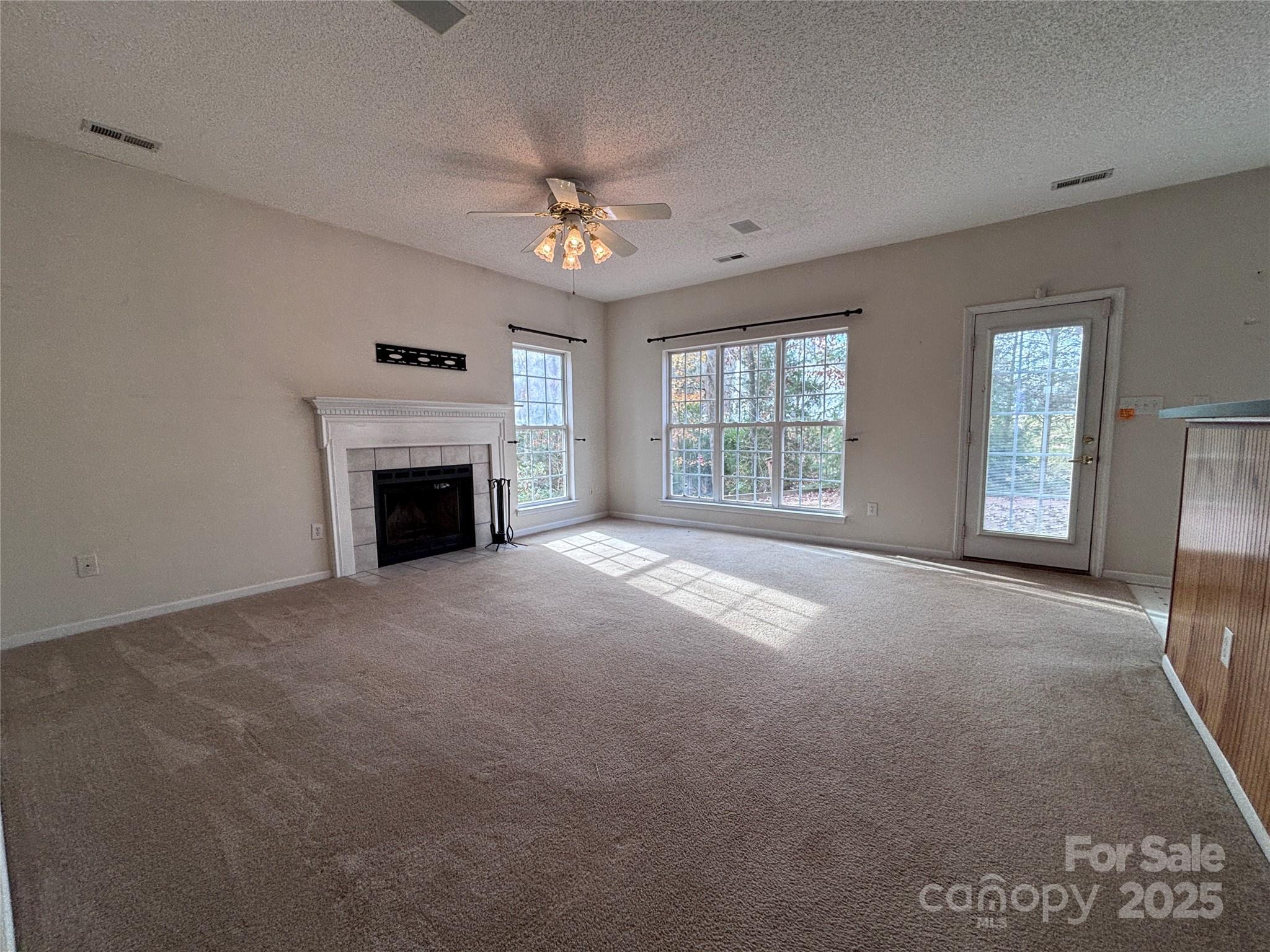 1600 Trotters Ridge Road Stanfield, NC 28163 - Photo 13 of 32 a view of empty room with a fireplace