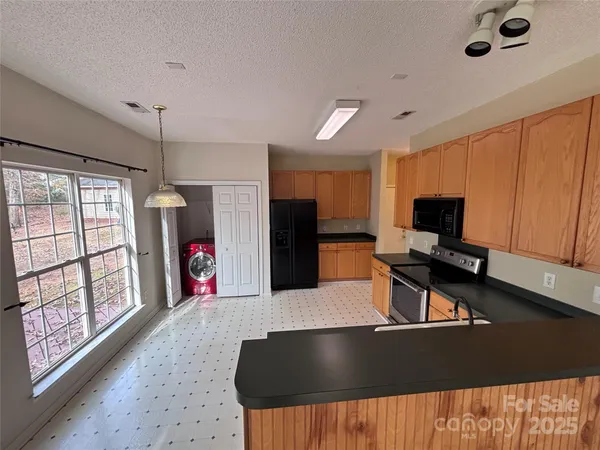 a living room with furniture window and flat screen tv