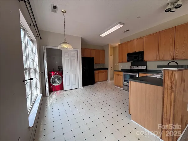 a view of a kitchen with a refrigerator stove top oven a sink and dishwasher