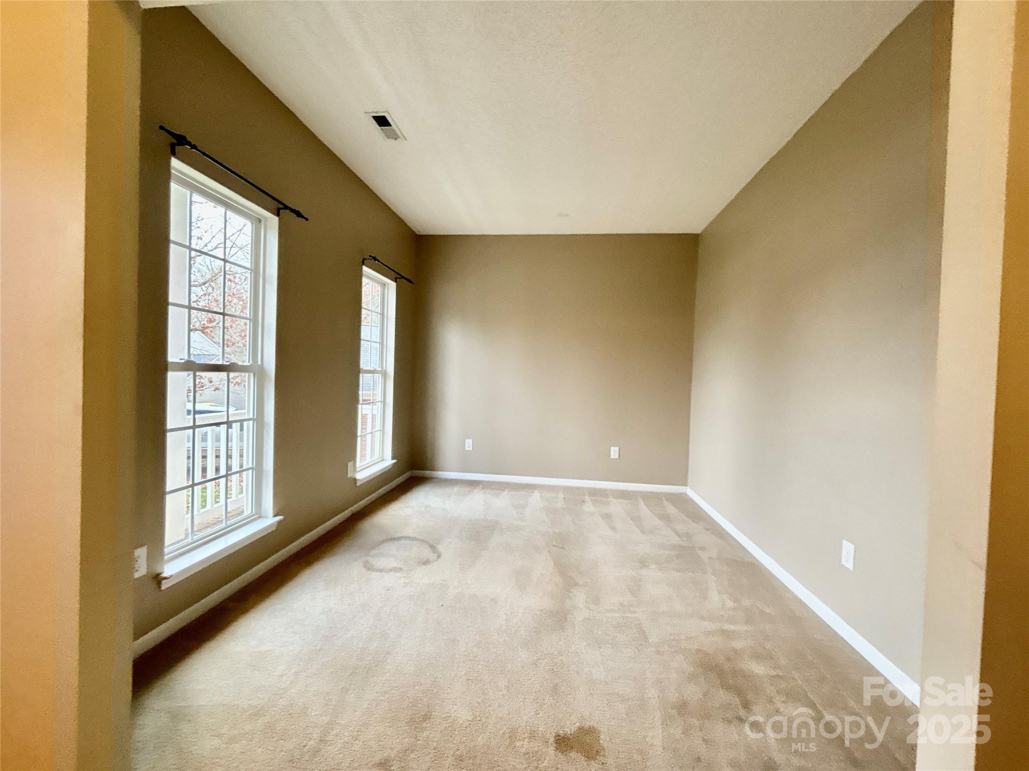 1600 Trotters Ridge Road Stanfield, NC 28163 - Photo 19 of 32 an empty room with windows