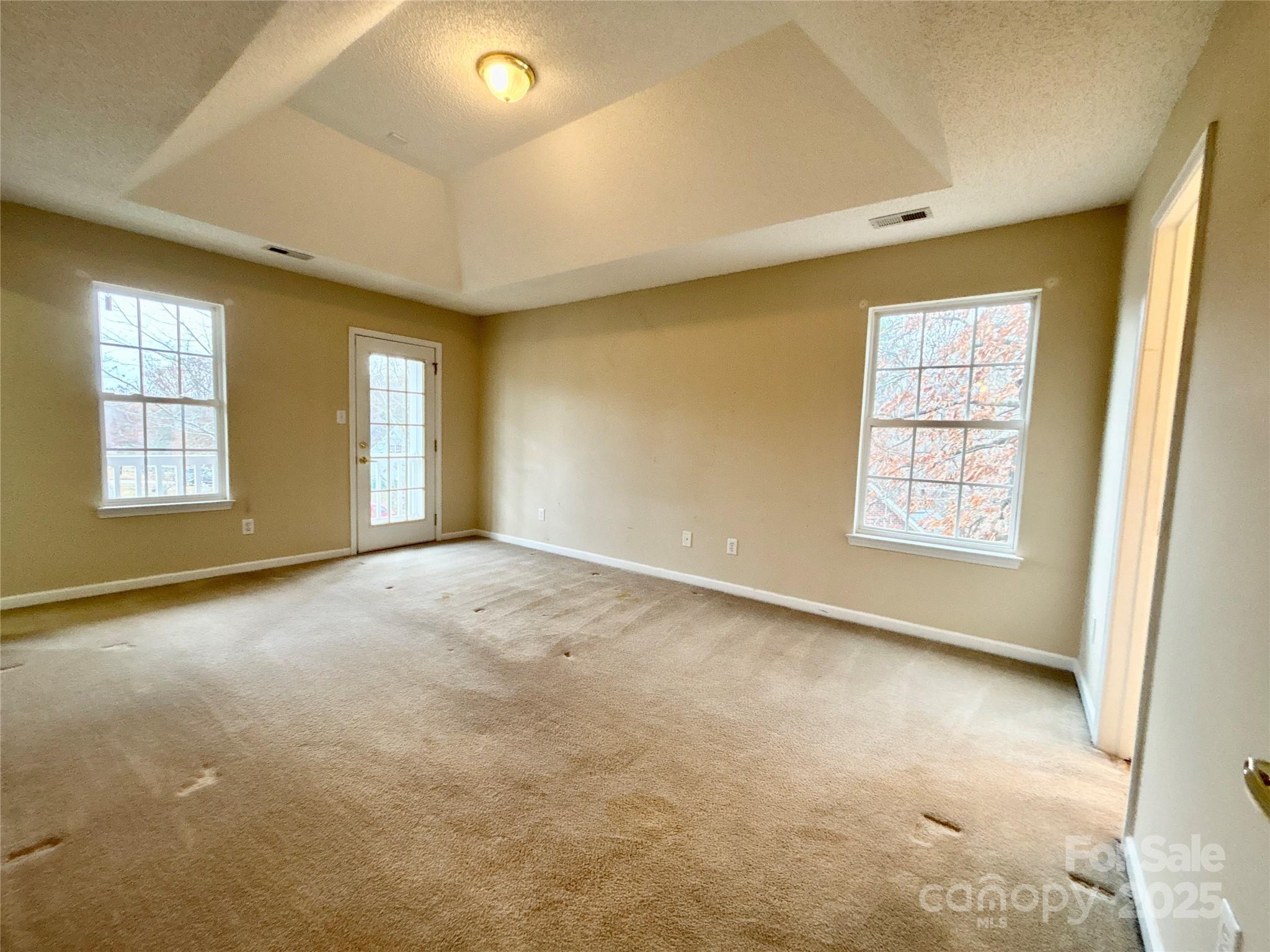 1600 Trotters Ridge Road Stanfield, NC 28163 - Photo 21 of 32 an empty room with windows