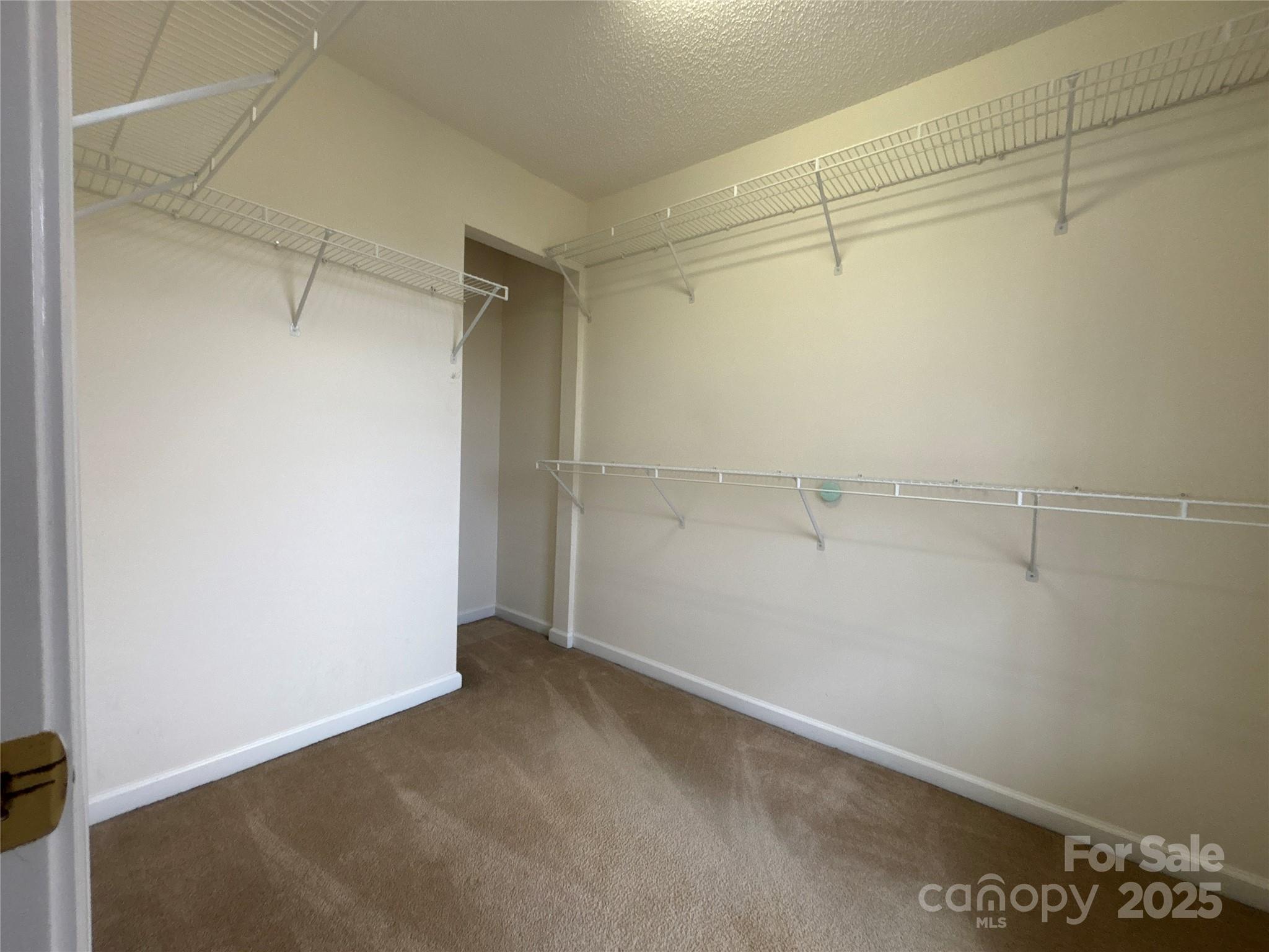1600 Trotters Ridge Road Stanfield, NC 28163 - Photo 24 of 32 a view of a room with racks on the wall