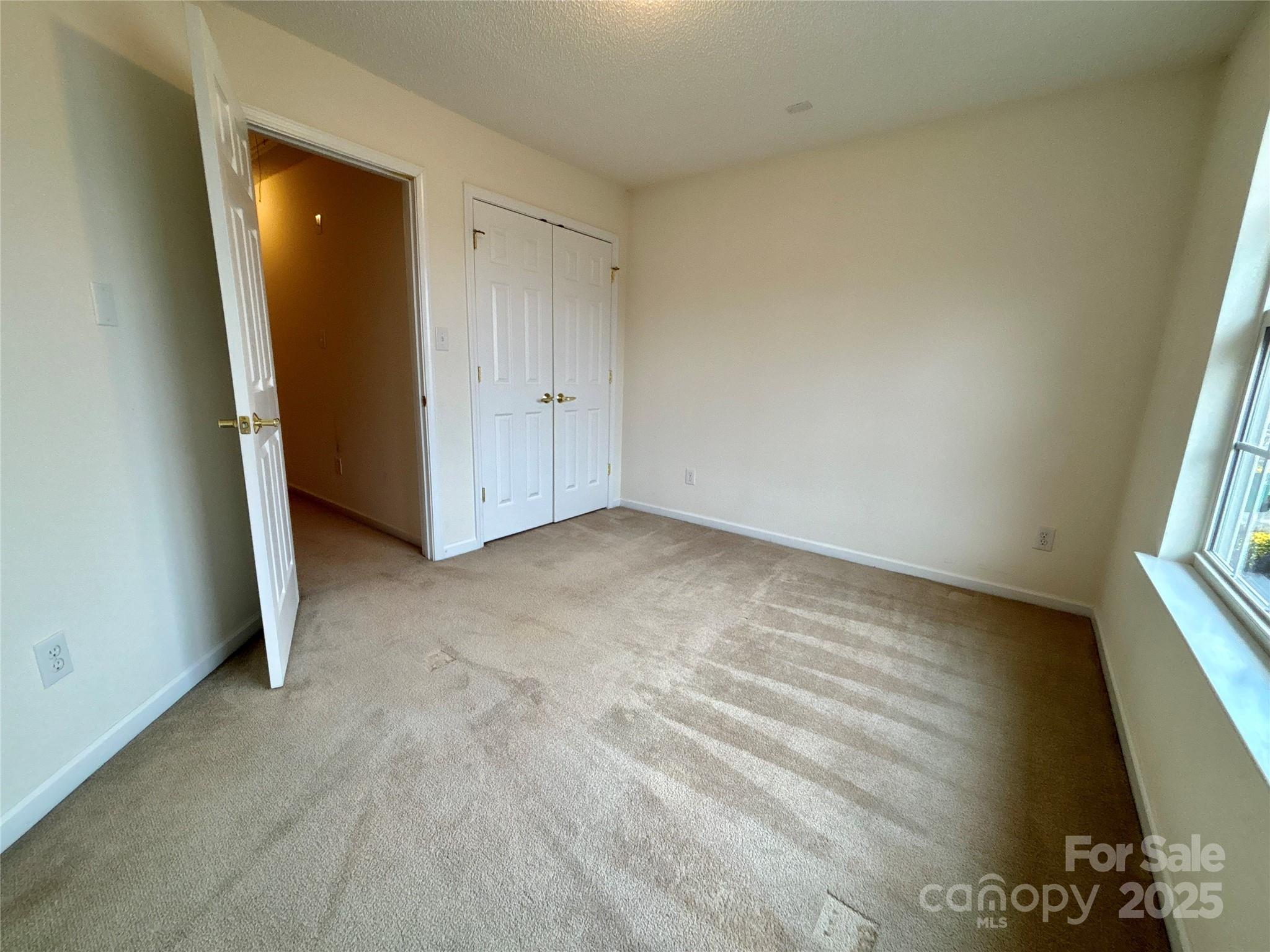 1600 Trotters Ridge Road Stanfield, NC 28163 - Photo 26 of 32 an empty room with windows