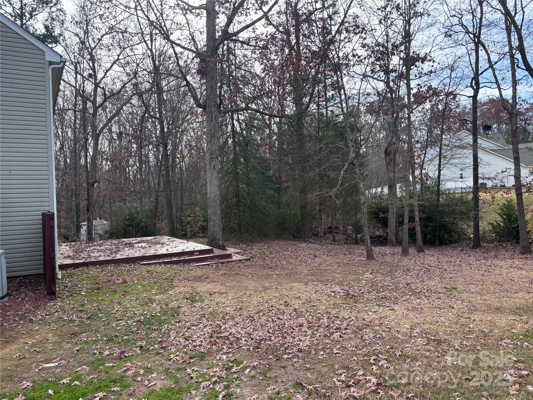 1600 Trotters Ridge Road Stanfield, NC 28163 - Photo 31 of 32 a view of a backyard with trees