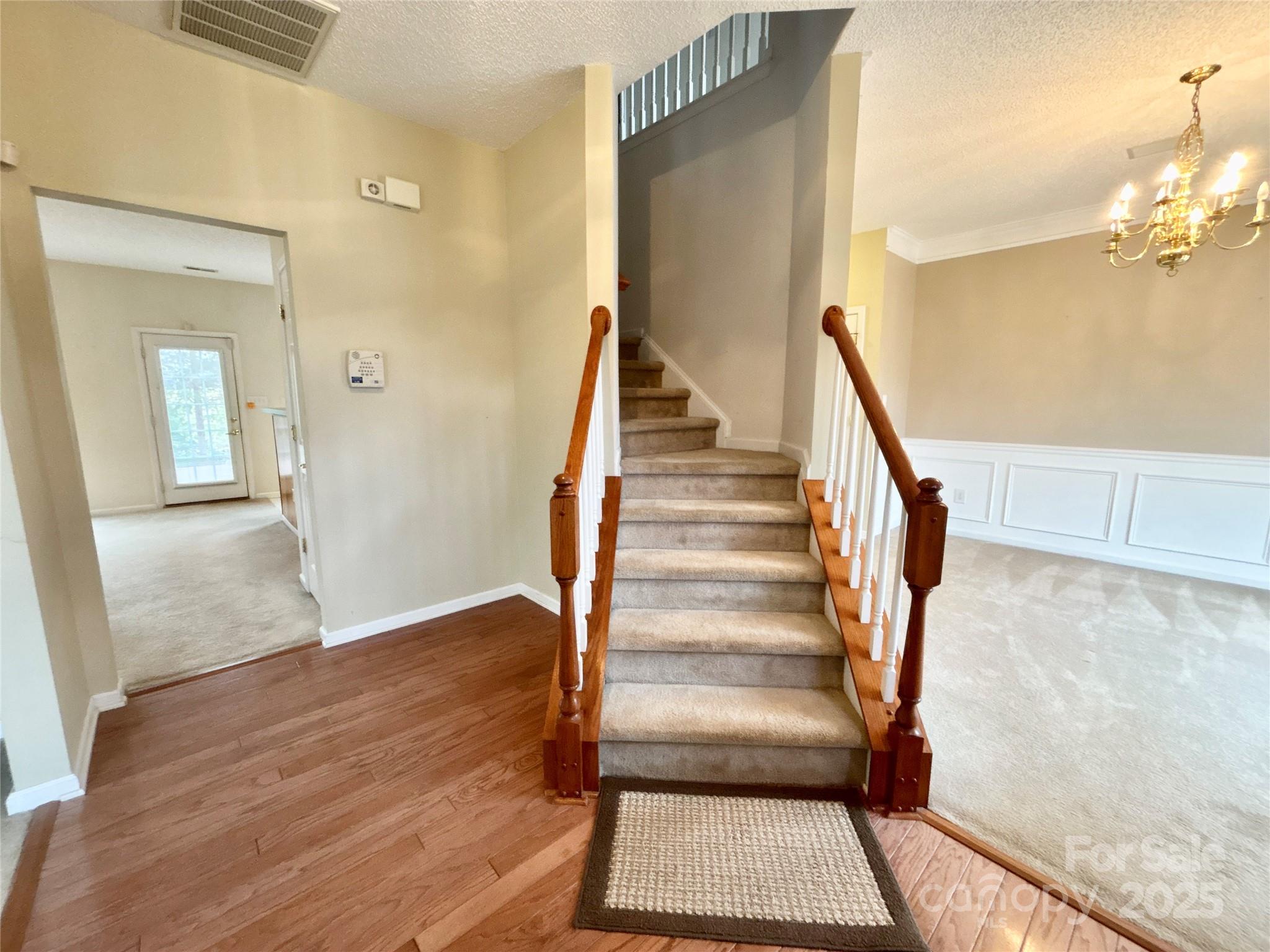 1600 Trotters Ridge Road Stanfield, NC 28163 - Photo 9 of 32 a view of a hallway with wooden floor and staircase