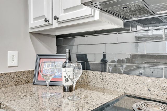 a view of an empty room with windows and closet