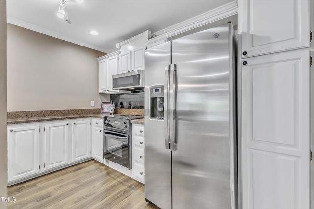 a bathroom with a sink double vanity and a mirror