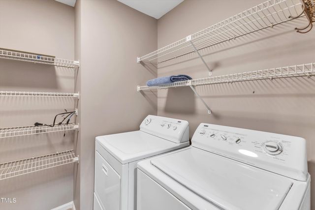 an aerial view of lake residential house with swimming pool and green space