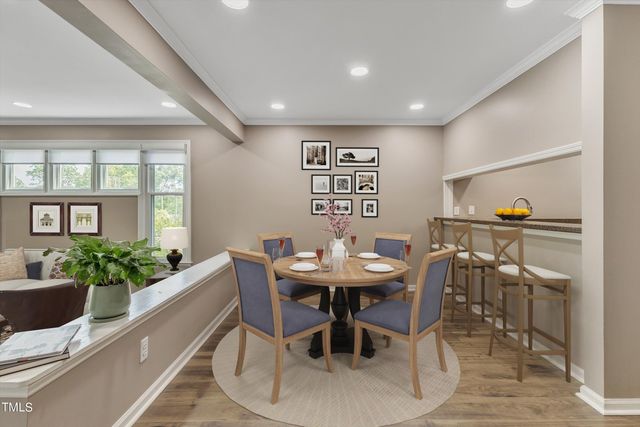 a kitchen with granite countertop a sink stainless steel appliances and cabinets