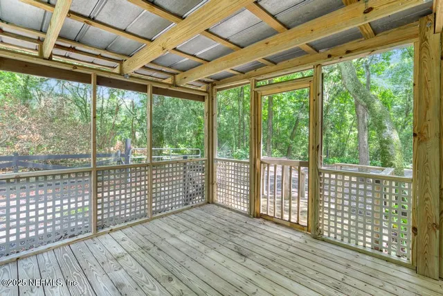 a view of a balcony with wooden floor
