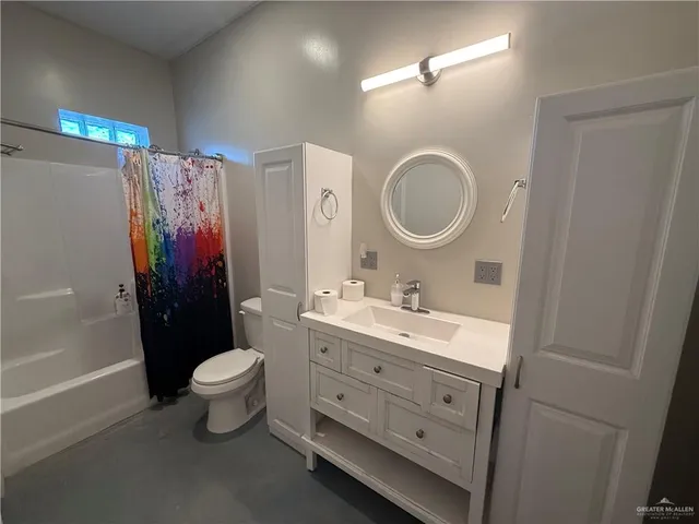 a kitchen with stainless steel appliances a refrigerator stove and microwave