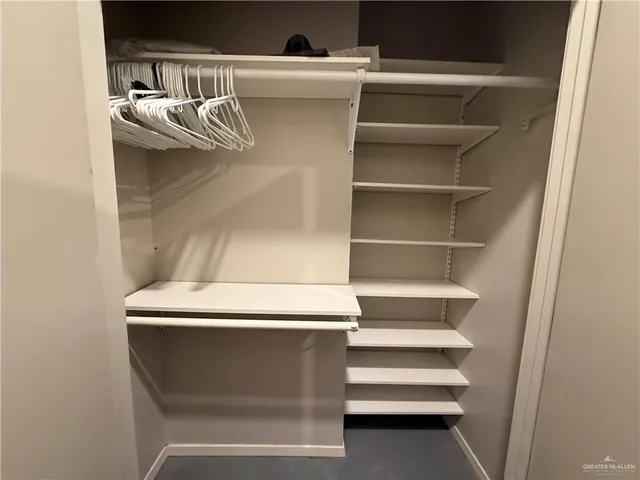 a kitchen with a refrigerator and a sink