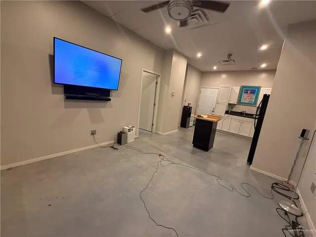 a view of room that has a ceiling fan