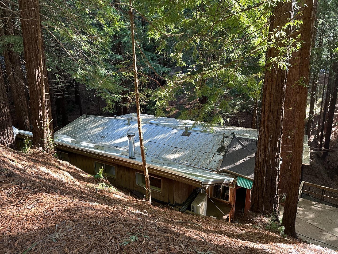 121 La Honda Road Woodside, CA 94062 - Photo 1 of 22 a view of a wooden deck next to a road