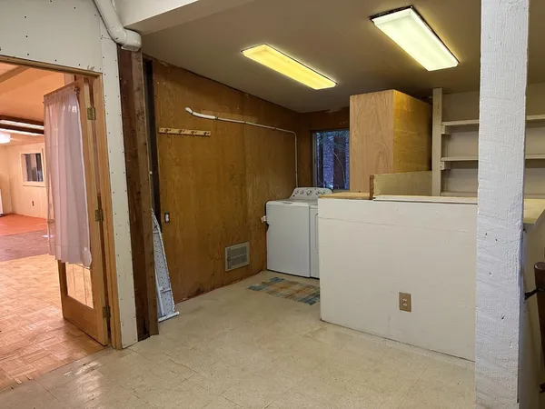 a view of a storage & utility room with a washer dryer