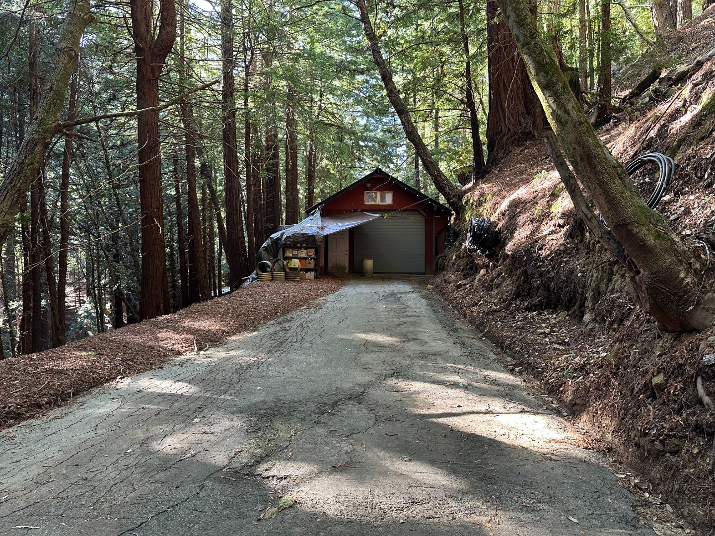 121 La Honda Road Woodside, CA 94062 - Photo 17 of 22 a backyard of a house with large trees and outdoor seating