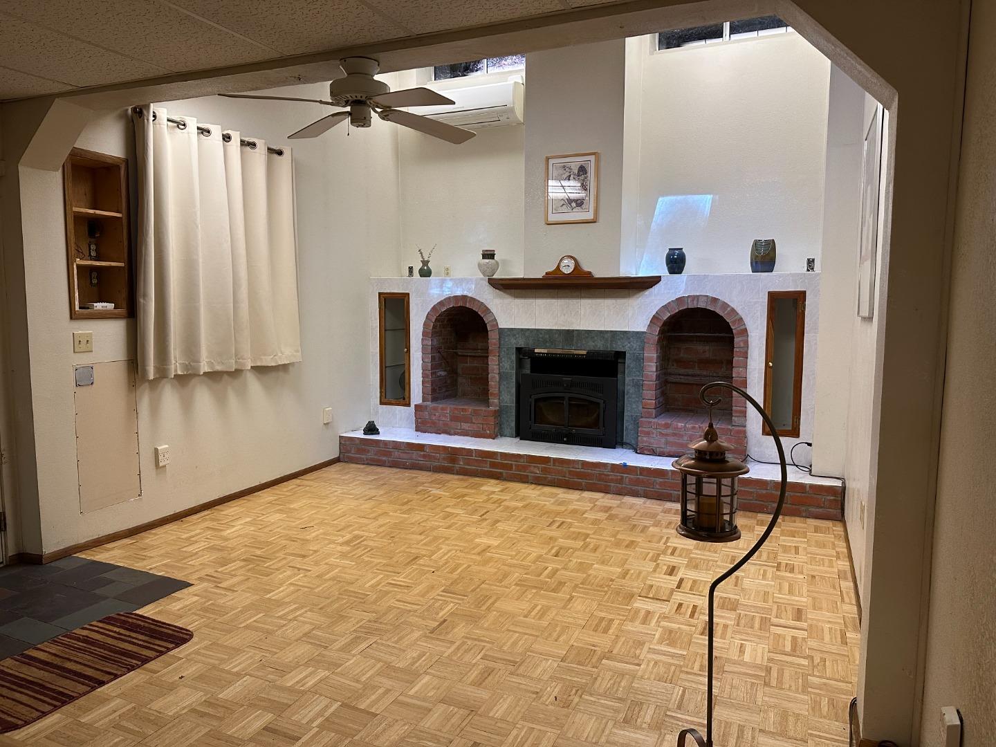 121 La Honda Road Woodside, CA 94062 - Photo 2 of 22 a view of a livingroom with furniture and a fireplace