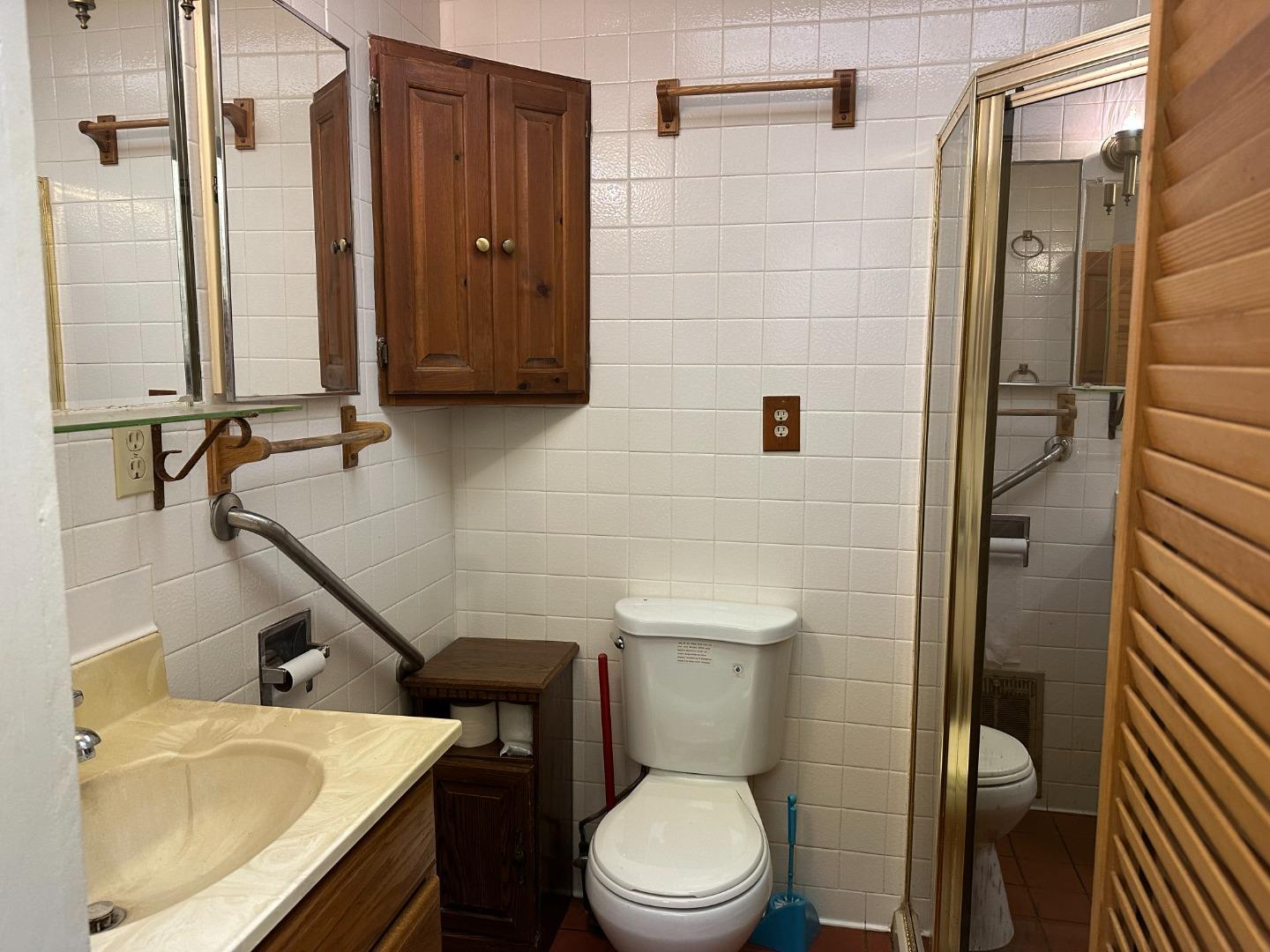 121 La Honda Road Woodside, CA 94062 - Photo 9 of 22 a bathroom with a sink a toilet and shower