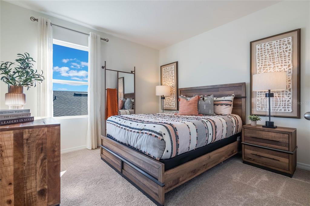 3415 Nettle Loop Tavares, FL 32778 - Photo 25 of 28 a bedroom with a bed and window