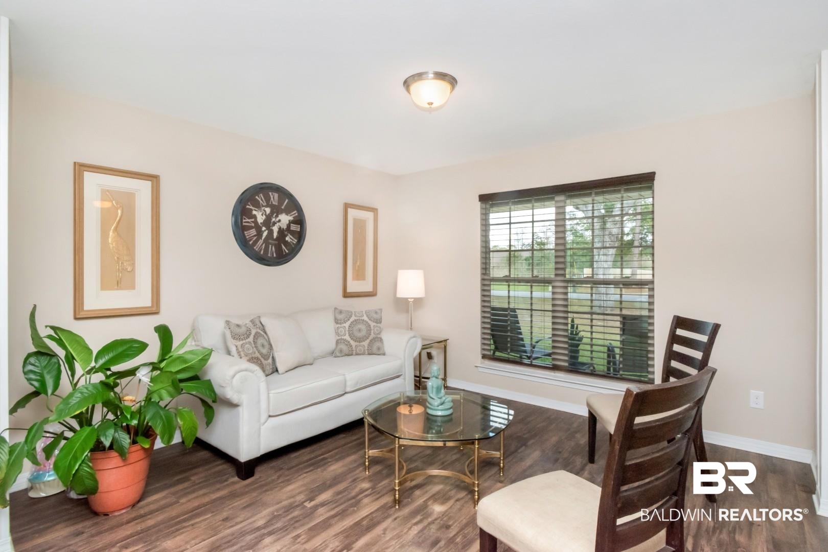 11528 Mocking Bird Lane Fairhope, AL 36532 - Photo 25 of 45 Living area with dark wood-style flooring and baseboards