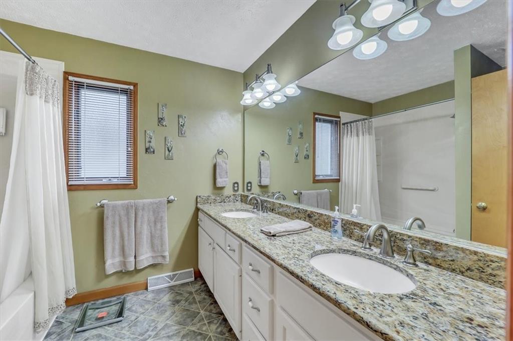 351 Cobblestone Circle McKees Rocks, PA 15136 - Photo 13 of 23 a bathroom with a granite countertop double vanity sink and a mirror