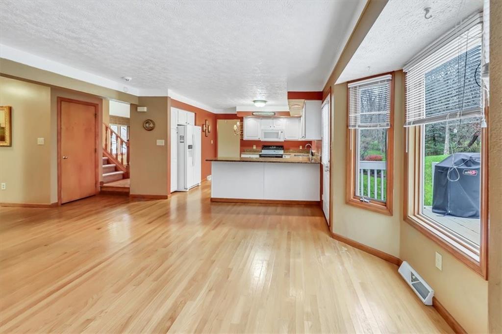 351 Cobblestone Circle McKees Rocks, PA 15136 - Photo 5 of 23 a view of a living room hardwood floor and a kitchen