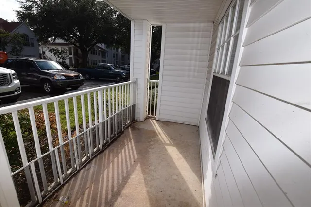 a view of balcony and wooden floor