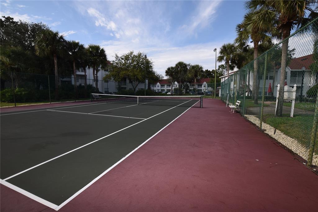 11550 Westwood Boulevard, Unit 1215 Orlando, FL 32821 - Photo 12 of 16 a view of a tennis court