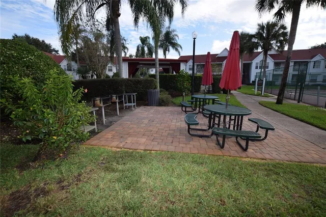 a view of a chairs and table in backyard of the house