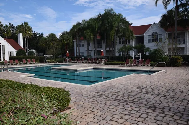 a view of a house with a yard and plants