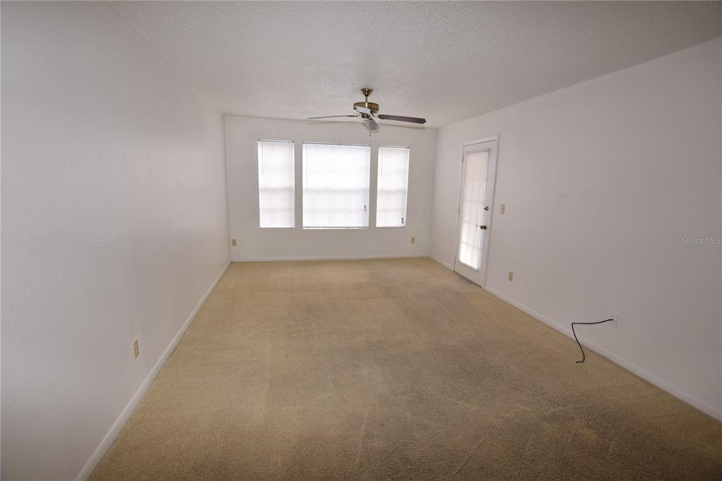 11550 Westwood Boulevard, Unit 1215 Orlando, FL 32821 - Photo 2 of 16 an empty room with a window