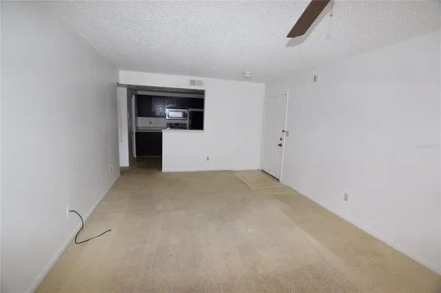 a view of a storage & utility room with a sink