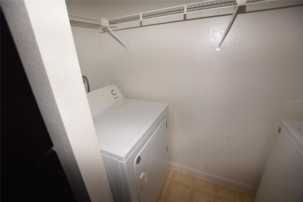 11550 Westwood Boulevard, Unit 1215 Orlando, FL 32821 - Photo 6 of 16 a bathroom with a sink and vanity