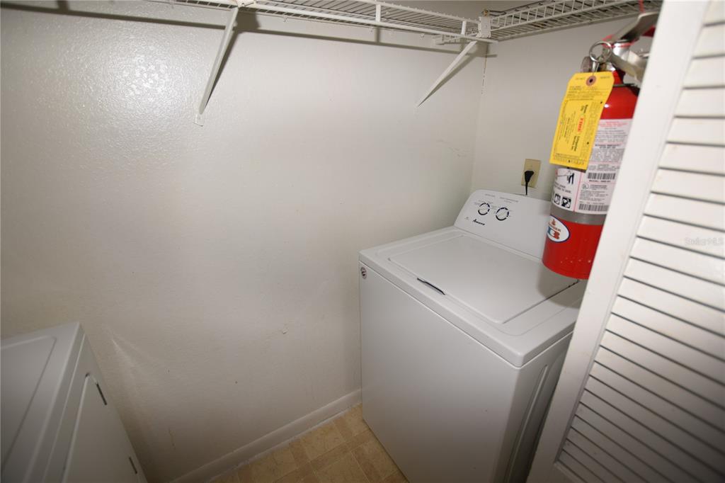 11550 Westwood Boulevard, Unit 1215 Orlando, FL 32821 - Photo 7 of 16 a utility room with dryer and washer