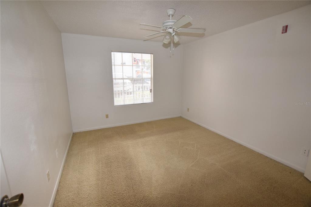 11550 Westwood Boulevard, Unit 1215 Orlando, FL 32821 - Photo 8 of 16 an empty room with a window
