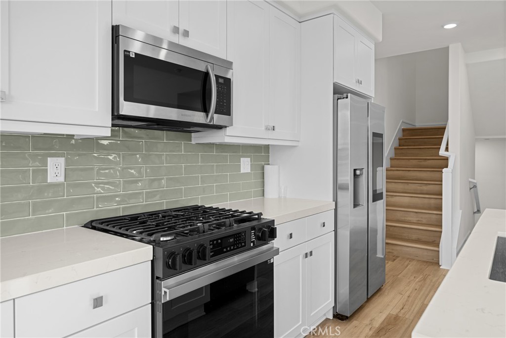 1713 Jade Road Rancho Mission Viejo, CA 92694 - Photo 16 of 53 a stove top oven sitting inside of a kitchen