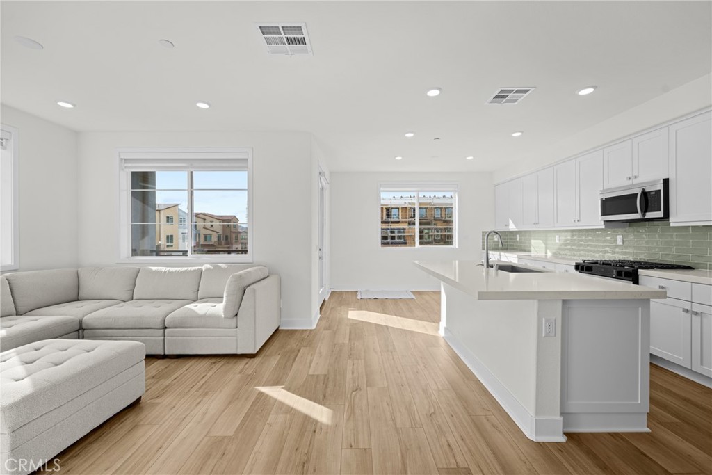 1713 Jade Road Rancho Mission Viejo, CA 92694 - Photo 28 of 53 a living room with furniture and a flat screen tv