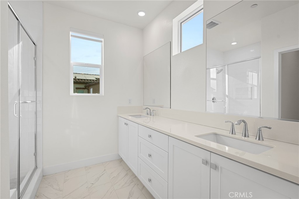 1713 Jade Road Rancho Mission Viejo, CA 92694 - Photo 41 of 53 a bathroom with double sink and a mirror