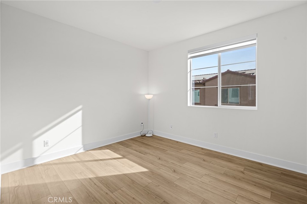 1713 Jade Road Rancho Mission Viejo, CA 92694 - Photo 44 of 53 a view of empty room with wooden floor and fan
