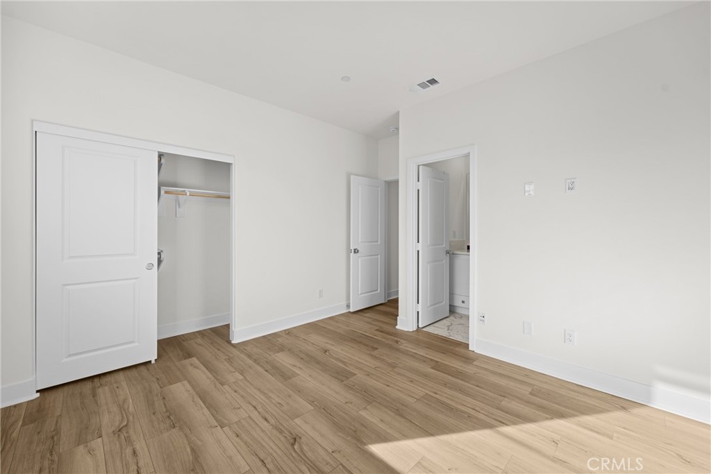 1713 Jade Road Rancho Mission Viejo, CA 92694 - Photo 45 of 53 a view of an empty room with wooden floor